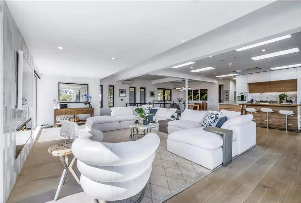 Great Room w/ walk out to front and side patios, primary bdr