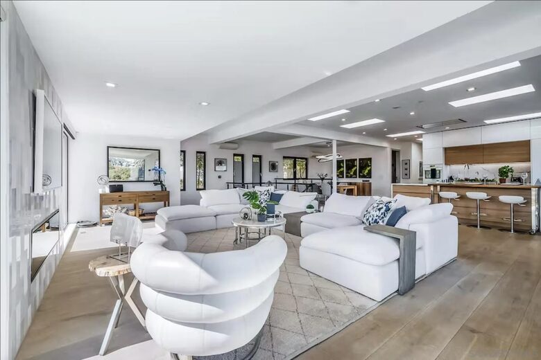 Great Room w/ walk out to front and side patios, primary bdr