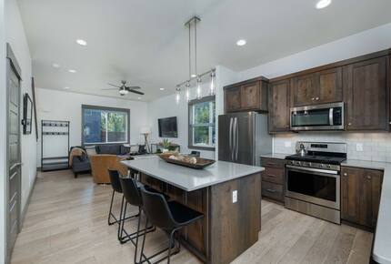 Kitchen island has additional seating for three