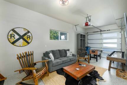 Garage is a game room with another TV area
