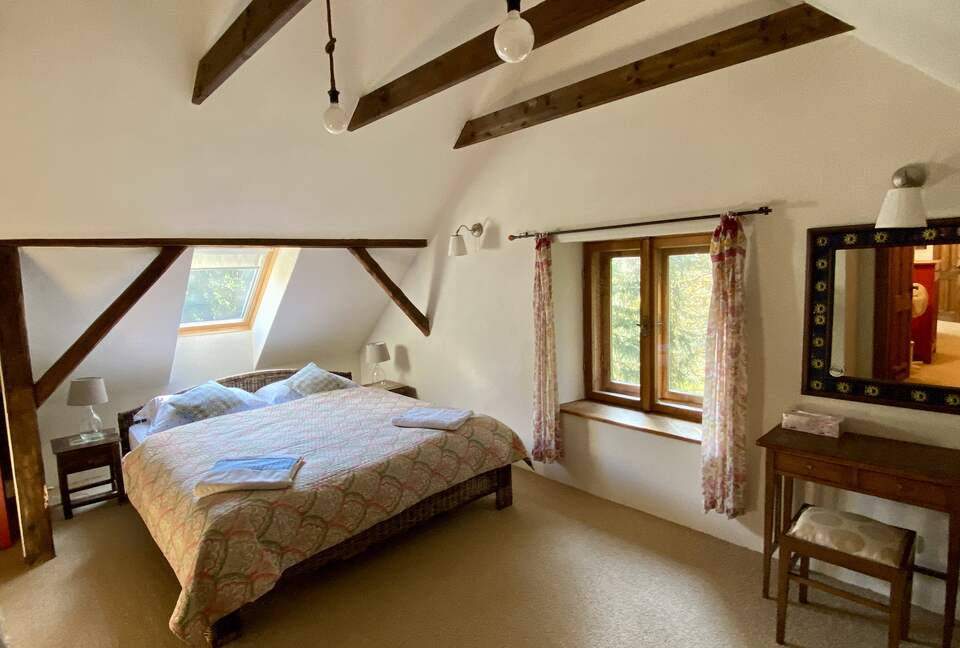Upstairs master bedroom with gorgeous view of forest, fields