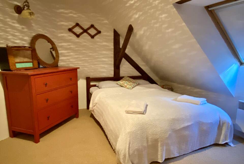 Double bedroom, with two single beds on other side of room