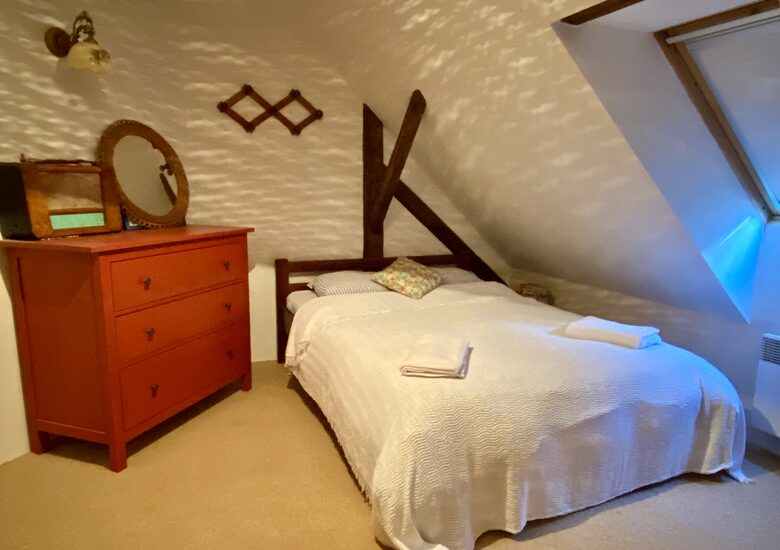 Double bedroom, with two single beds on other side of room