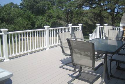 Large Deck with Large Weber Grill Overlooks Back Yard