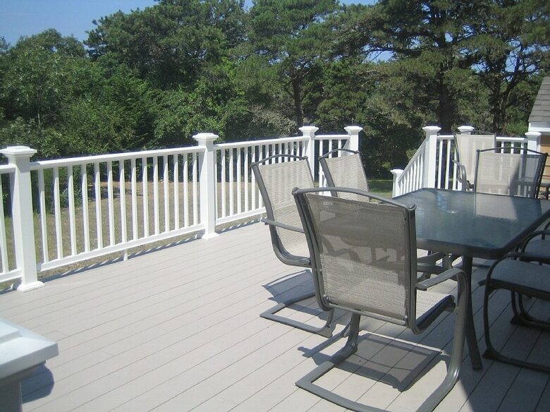 Large Deck with Large Weber Grill Overlooks Back Yard