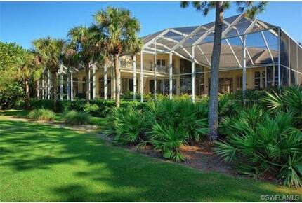 Bonita Bay Estate Home with glass walled dining room overlooking 10,000 gallon pond. - Bonita Springs, Florida