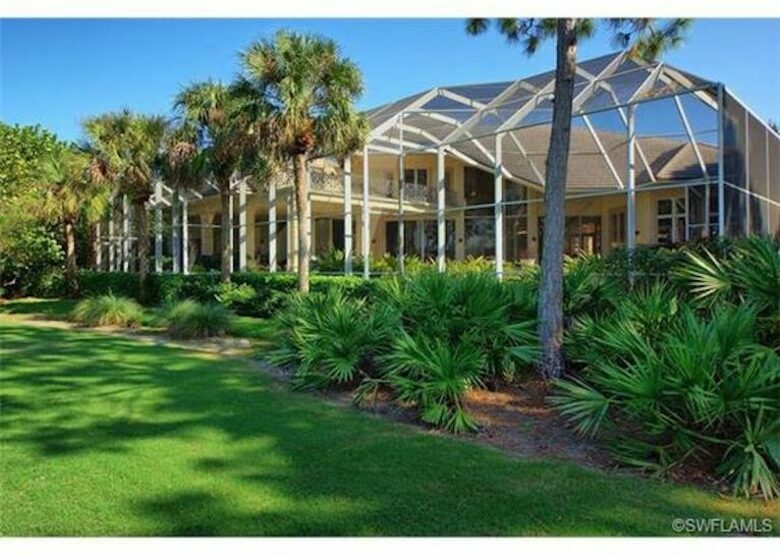 Bonita Bay Estate Home with glass walled dining room overlooking 10,000 gallon pond. - Bonita Springs, Florida